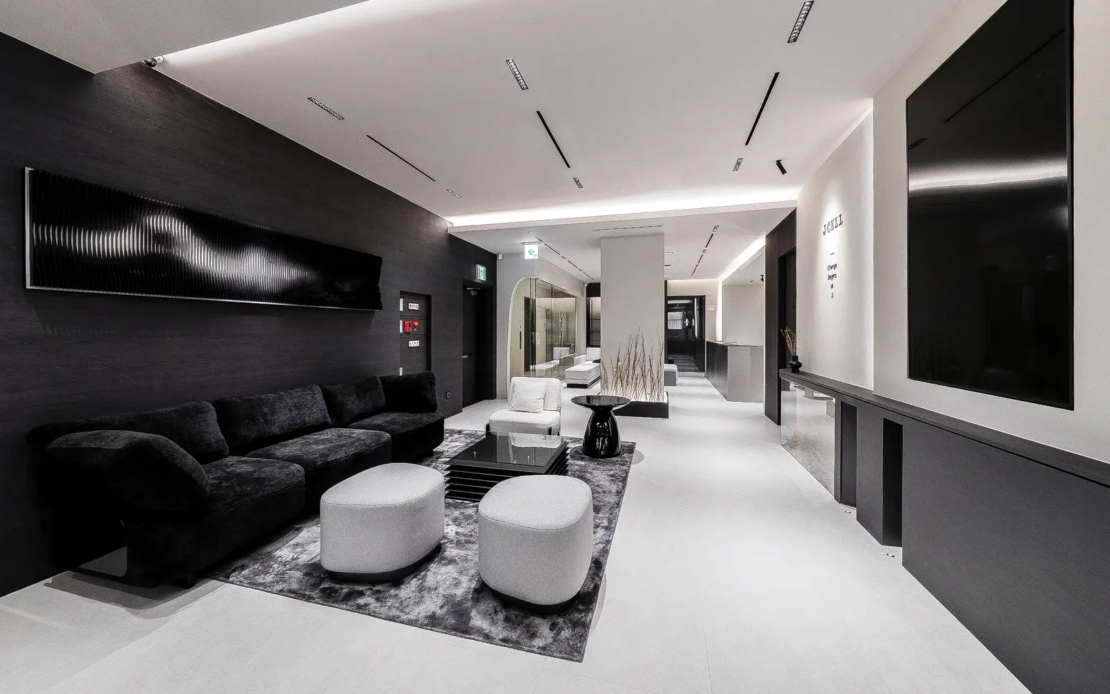 Lounge seating and tables inside Jcell Clinic